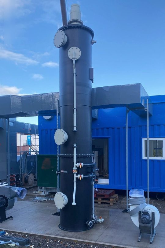 Full height packed tower with access hatches and extract fan