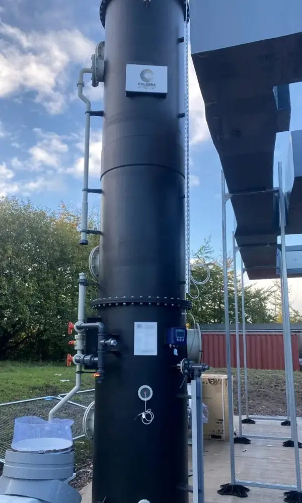Black polypropylene packed tower with the Caldera nameplate